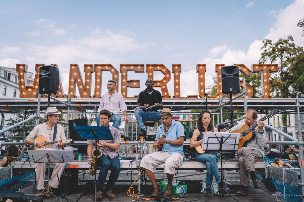 Live band under the Wanderlust marquee letters — BBP Wanderlust, Brussels