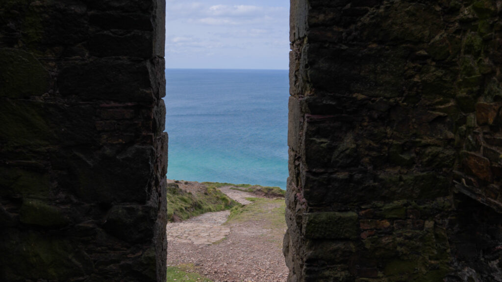 View through the engine-house wall to the Atlantic — Cornish heritage site