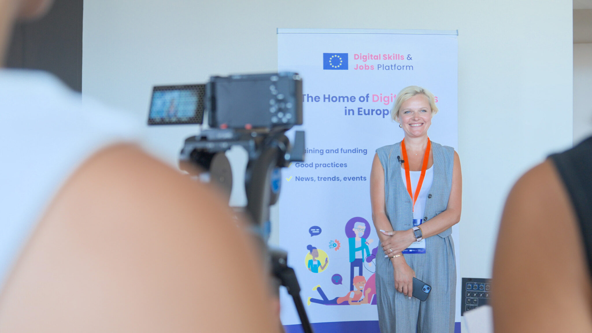 Camera filming an interview in front of the EU Digital Skills and Jobs Platform banner, Brussels