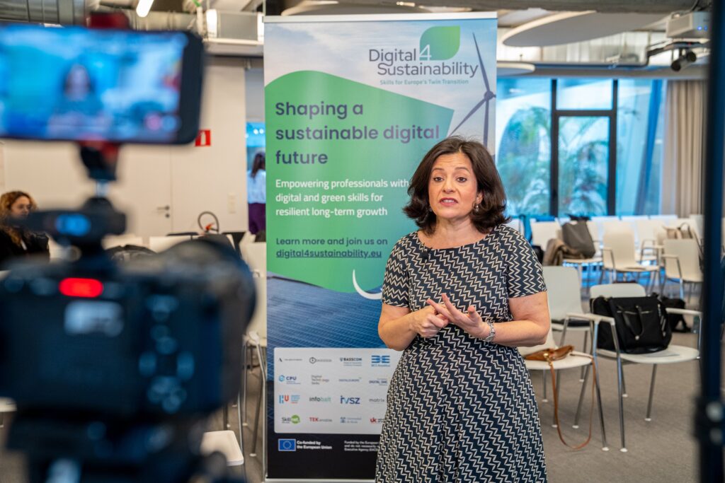 Interview set from behind the camera, speaker in front of the Digital4Sustainability roll-up