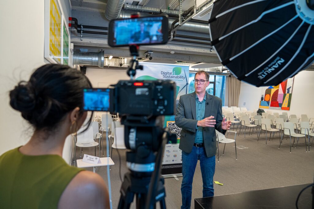 Lit interview corner with softbox, camera and interviewer